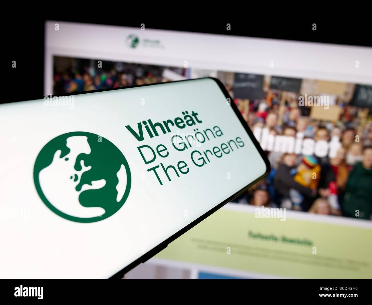 Stuttgart, Germany - 07‑25‑2025: Smartphone with logo of Finnish political party Vihrea Liitto (Vihreat) on screen in front of website. Stock Photo