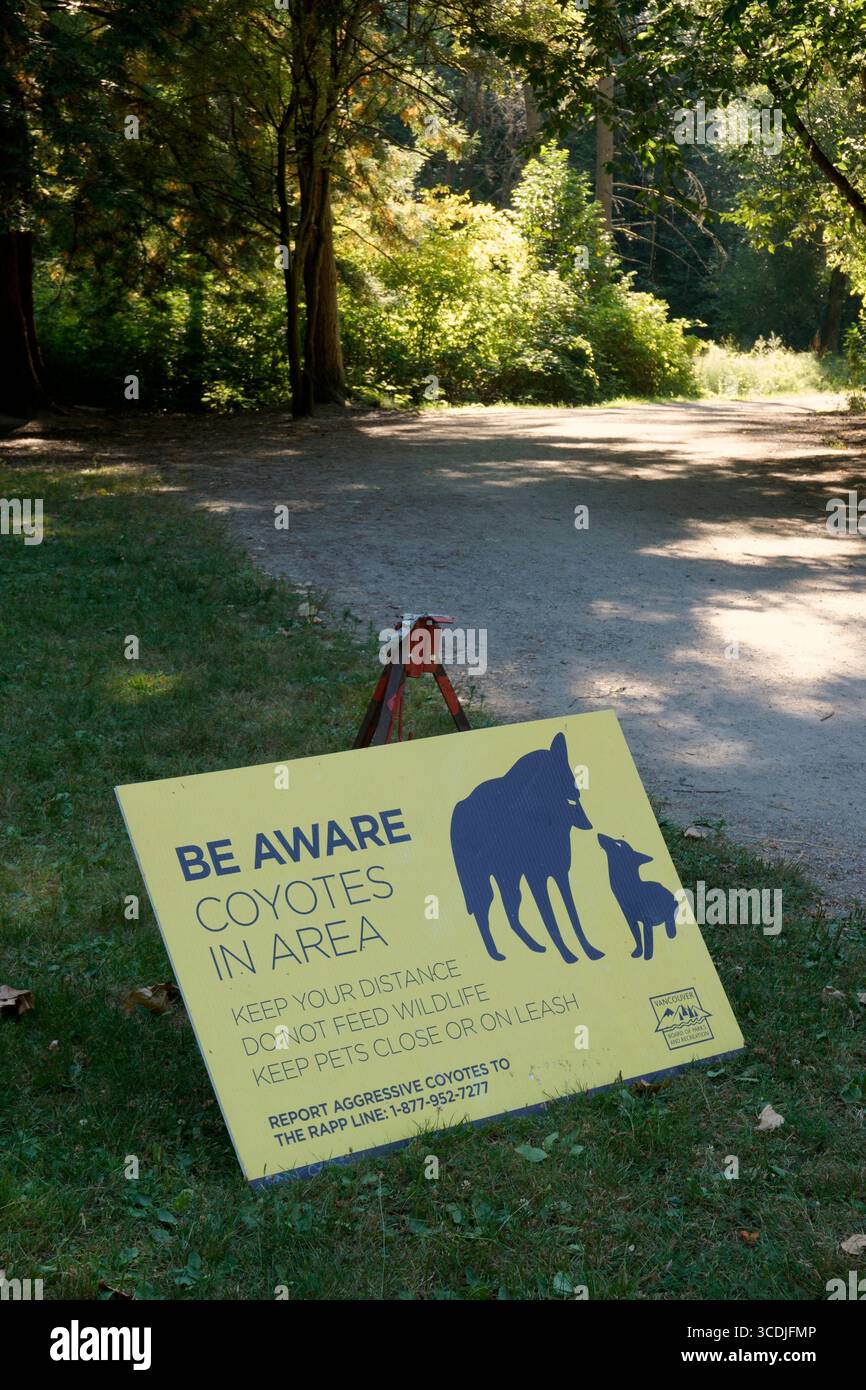 Sign warning of coyotes in Jericho Beach Park, Vancouver, British Columbia, Canada Stock Photo