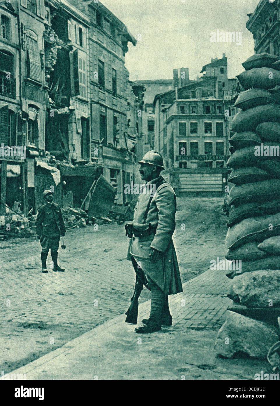Verdun city street scene after German bombardment, WW1, 1916.  Sandbagged, shell shattered, but still in French hands. Stock Photo
