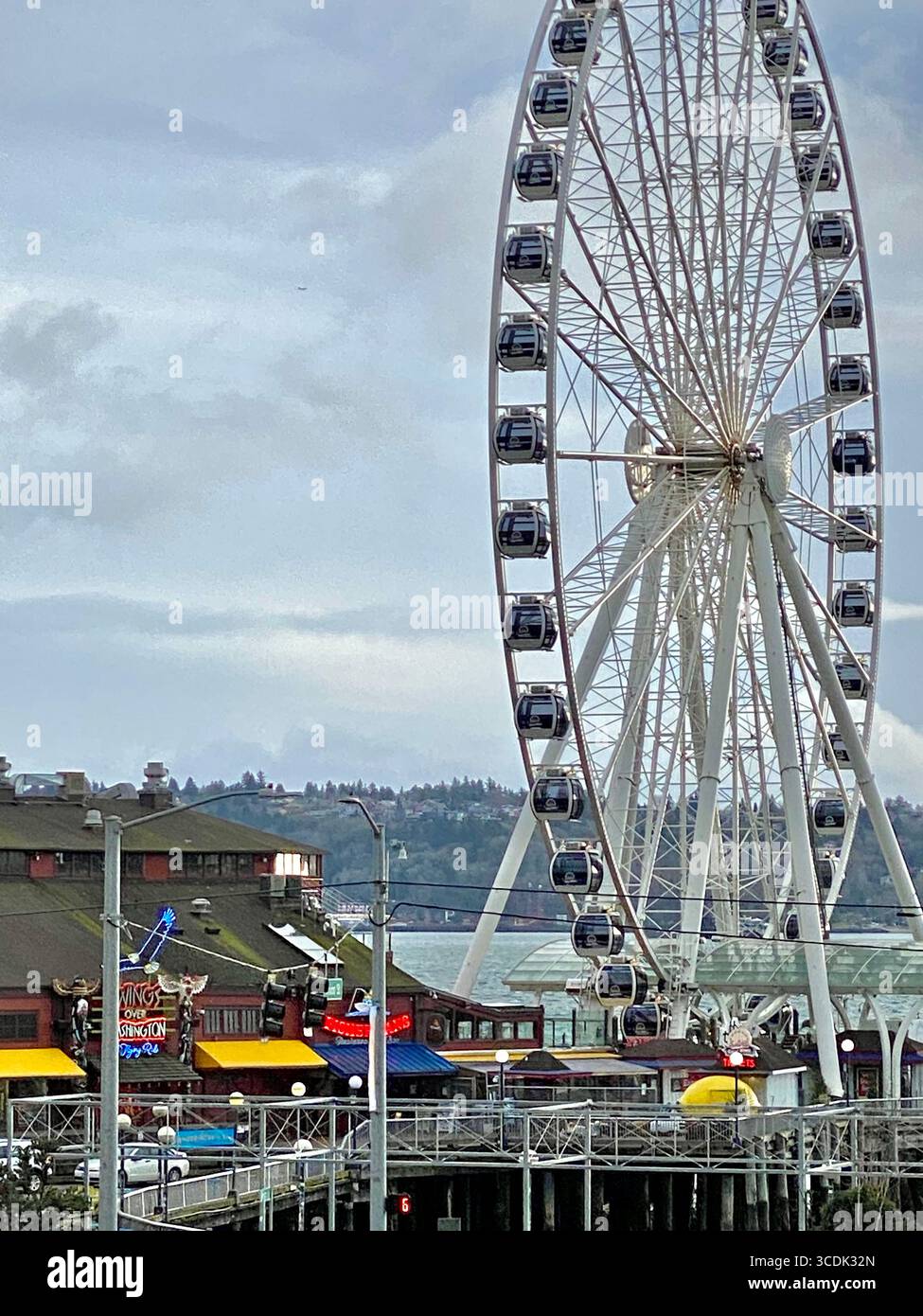 The Seattle Great Wheel at Pier 57 on a mostly cloudy day. - Smartphone Captured Stock Image