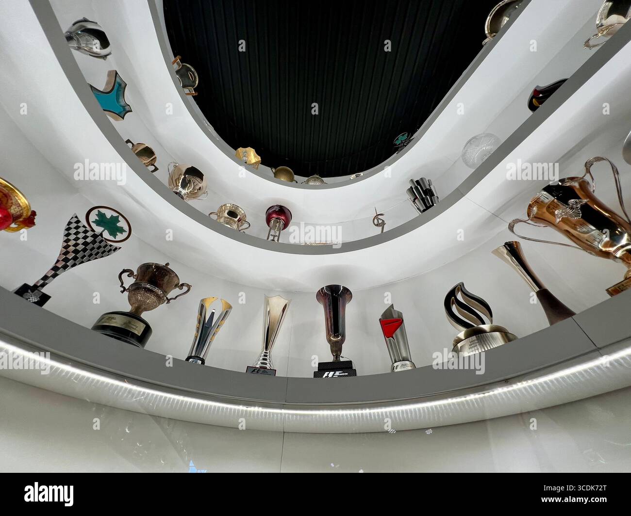 A curved portion of the trophy wall in Maranello's Museo Ferrari. - Smartphone Captured Stock Image