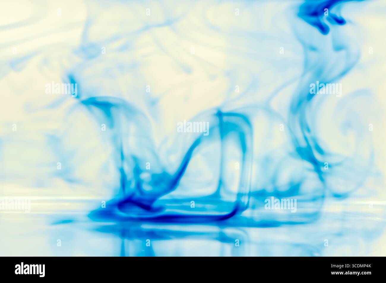 Abstract Blue Ink Diffusion in Water Creating Soft Fluid Patterns Stock Photo