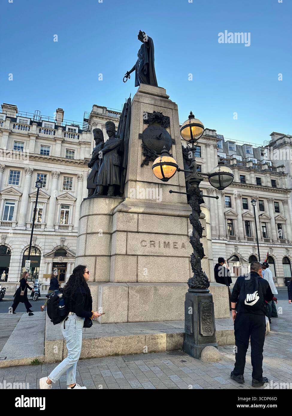 The Guards Crimean War Memorial featuring the Honor statue and infantrymen bronze figures in Waterloo Place, St. James's, Central London, England. - Smartphone Captured Stock Image