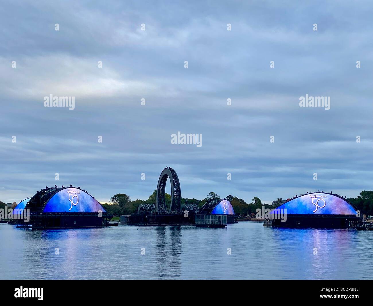 Structures lit up in Epcot's World Showcase Lagoon for Walt Disney World's 50th anniversary celebration in Orlando. - Smartphone Captured Stock Image