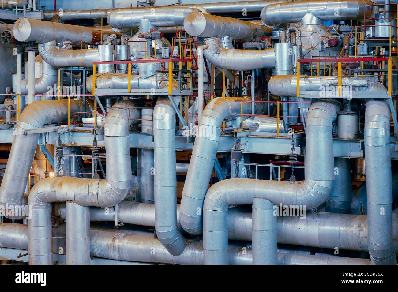 Industrial piping system with complex network of metal tubes in a ...