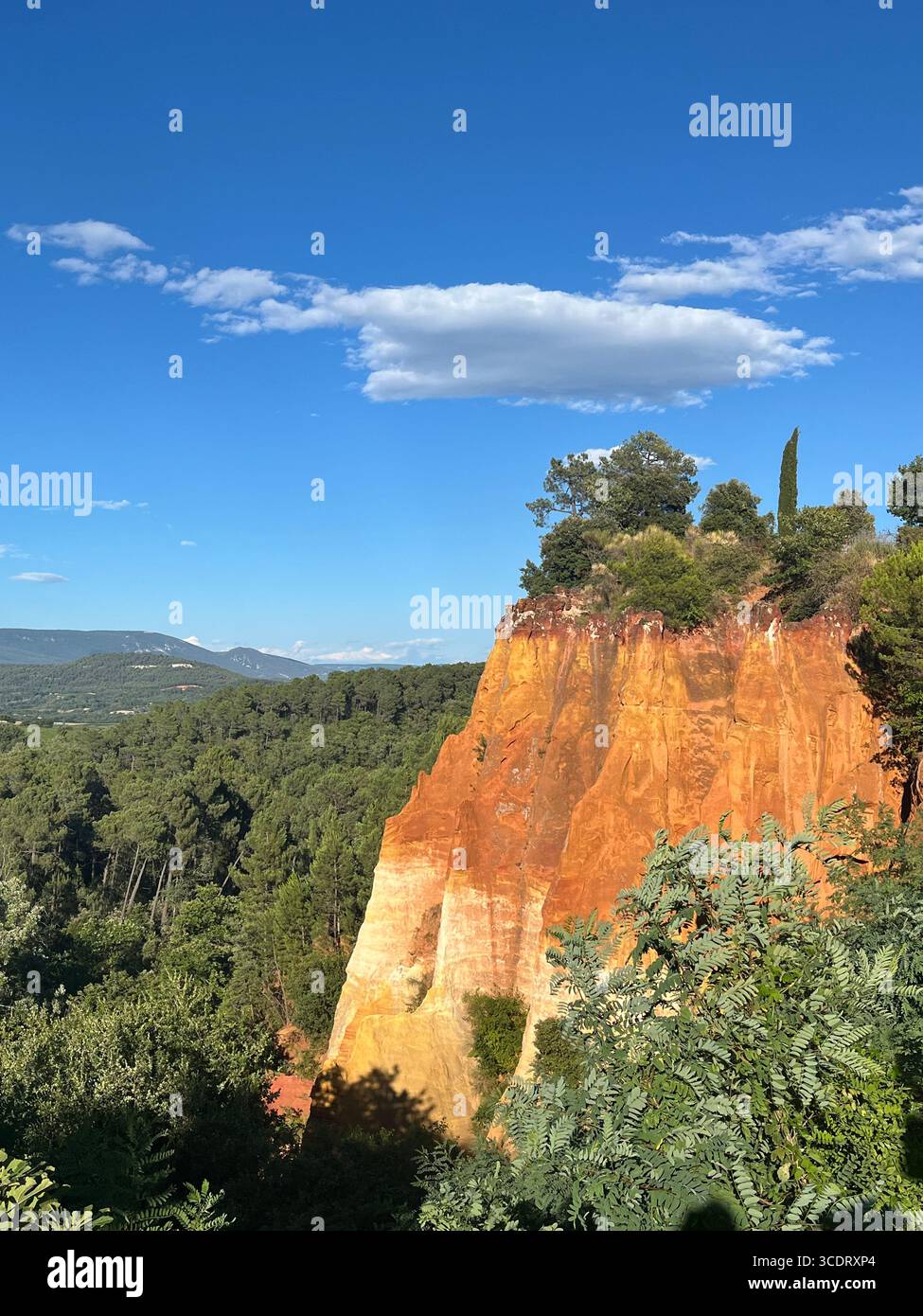 Mountain terrain with gradient colored cliff face in the South of France. - Smartphone Captured Stock Image