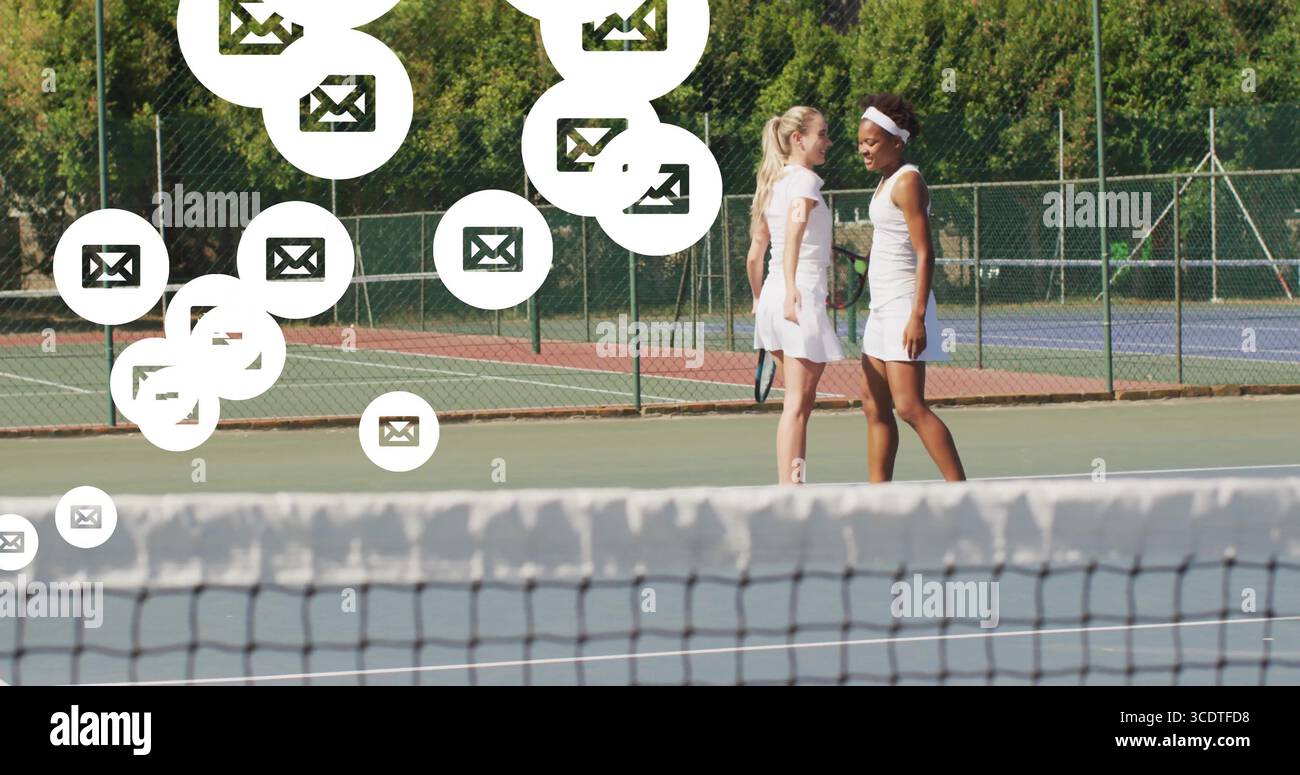 Practicing tennis players holding rackets on hard court, with floating ...