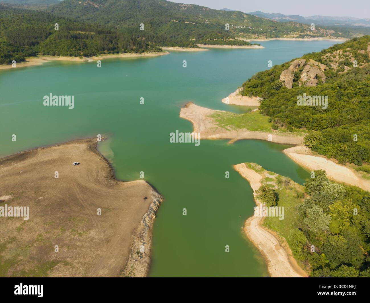 Aerial view of the Algeti Reservoir, where turquoise waters meet the ...
