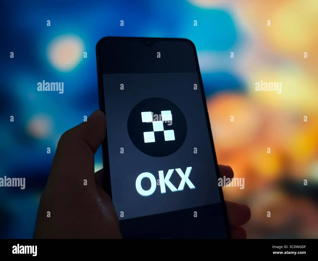 SUQIAN, CHINA - AUGUST 14, 2025 - A illustration photo shows OKX logo displayed in a smartphone in Suqian, Jiangsu Province, China on August 14, 2025. Stock Photo