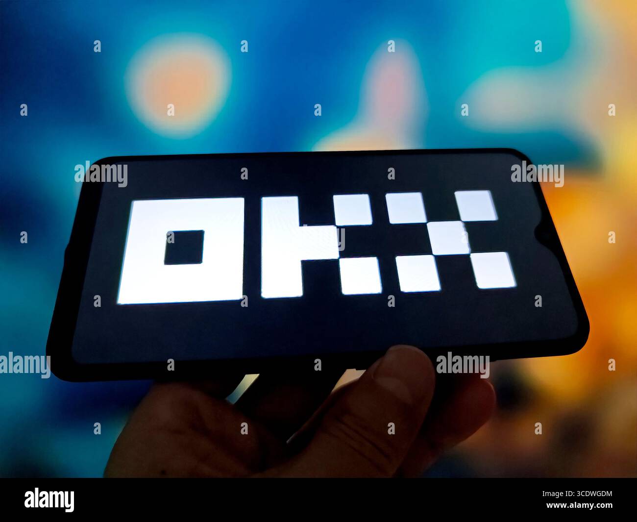SUQIAN, CHINA - AUGUST 14, 2025 - A illustration photo shows OKX logo displayed in a smartphone in Suqian, Jiangsu Province, China on August 14, 2025. Stock Photo