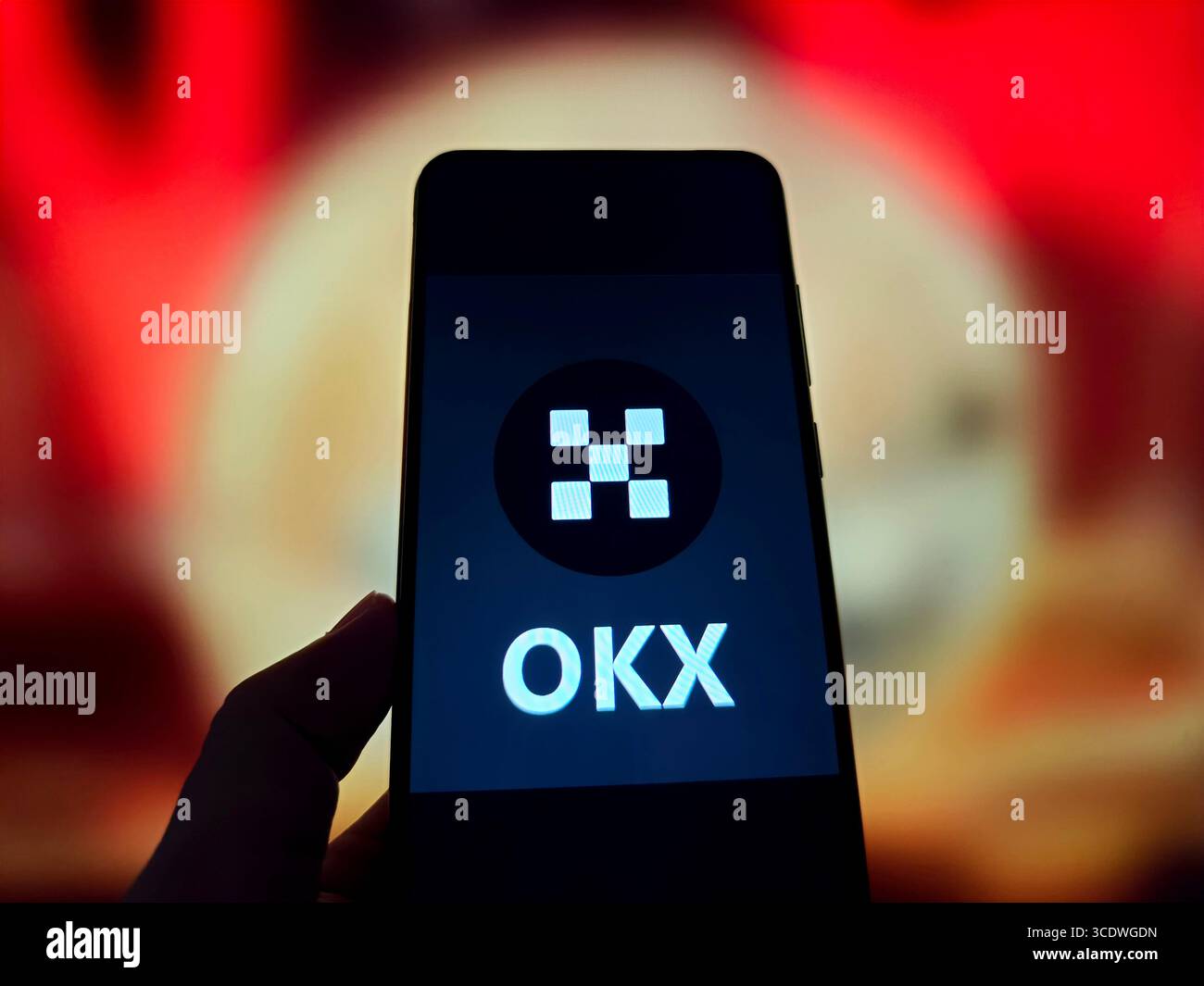 SUQIAN, CHINA - AUGUST 14, 2025 - A illustration photo shows OKX logo displayed in a smartphone in Suqian, Jiangsu Province, China on August 14, 2025. Stock Photo