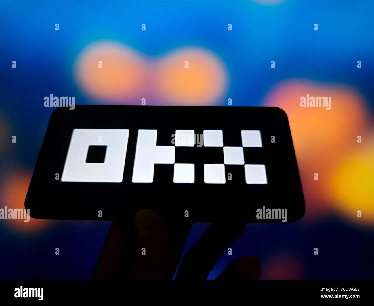 SUQIAN, CHINA - AUGUST 14, 2025 - A illustration photo shows OKX logo displayed in a smartphone in Suqian, Jiangsu Province, China on August 14, 2025. Stock Photo