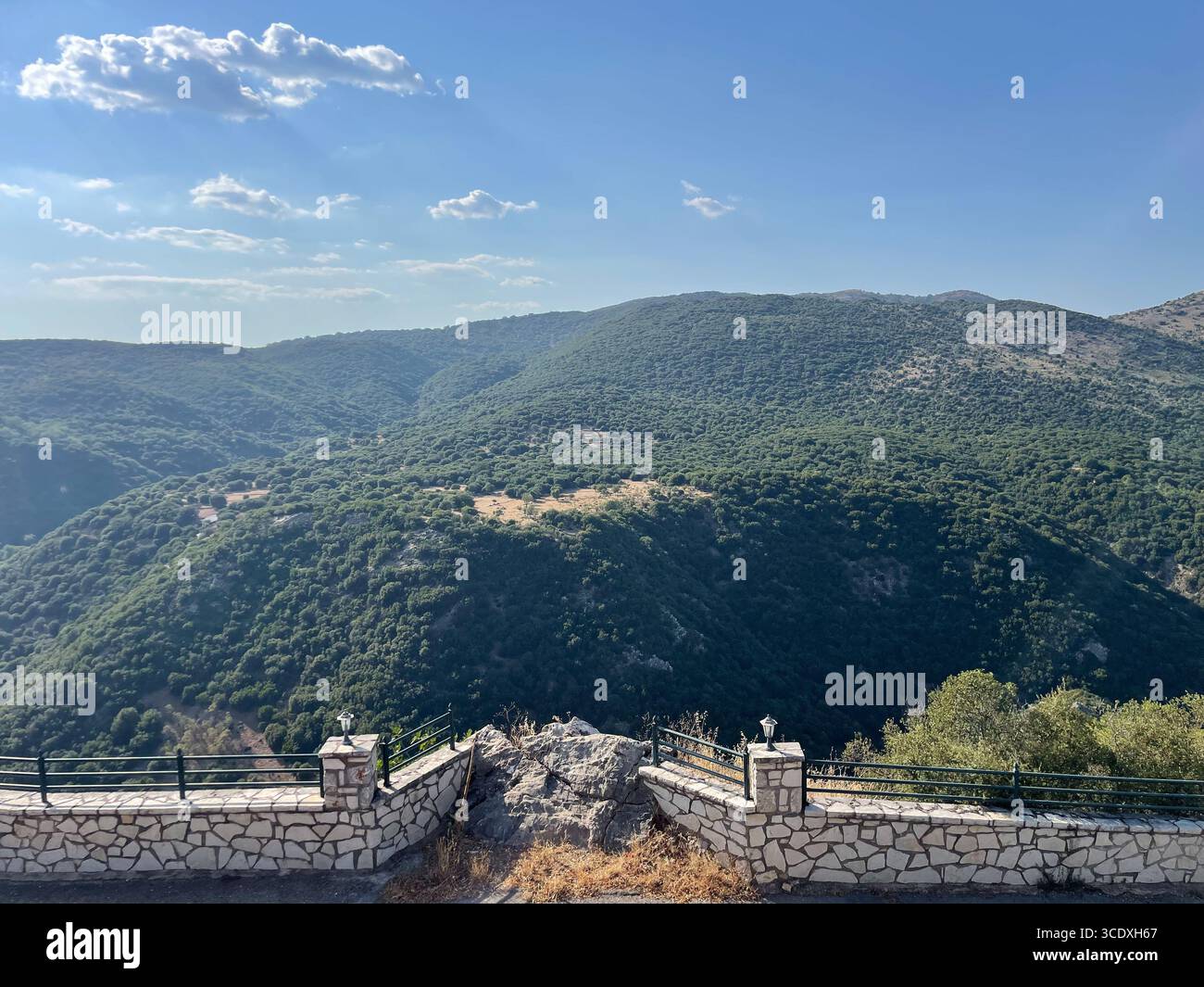 Mountain landscape view of Drakovouni village and the surrounding hills in Arcadia, Peloponnese, Greece, on a clear summer day. - Smartphone Captured Stock Image