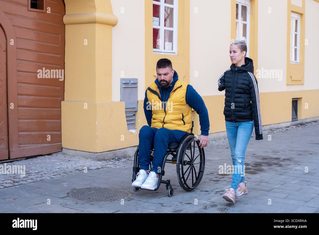 Man woman in wheelchair hi-res stock photography and images - Alamy