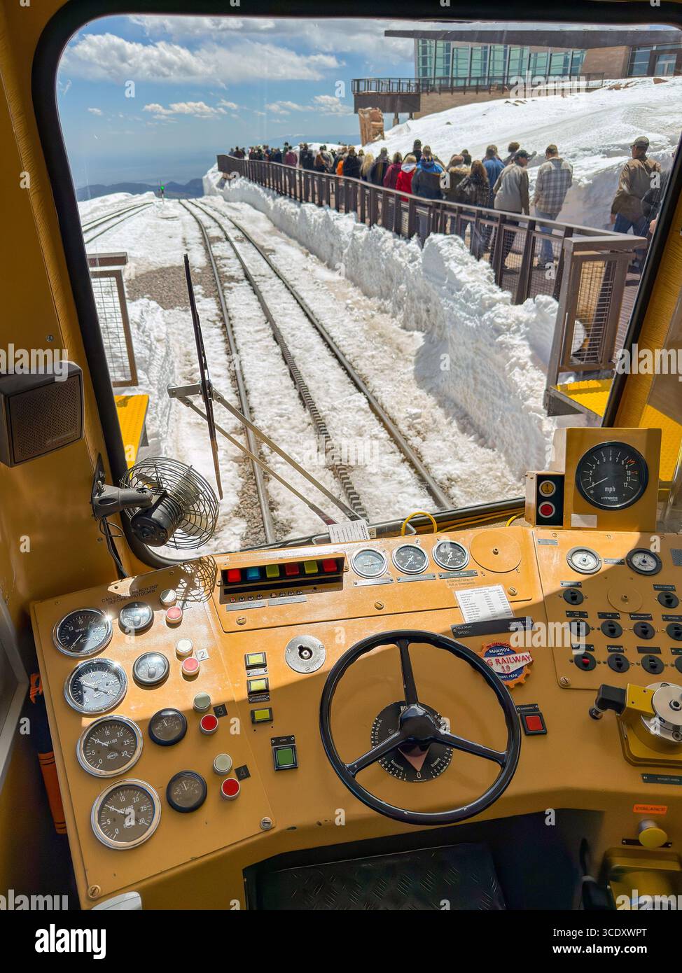 Manitou Springs, Colorado, USA - 21 May 2025: People leaving the platform of the Pike's Peak Cog railway at the summit seen through the driver's cab - Smartphone Captured Stock Image