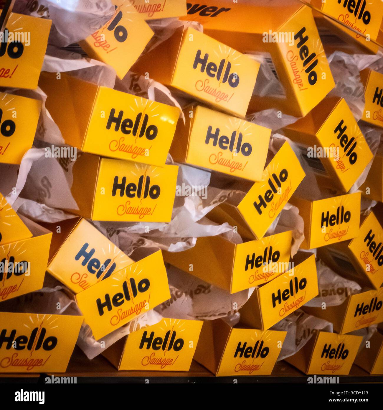 Hello Sausage - a stack of Rollover cinema hot dog boxes - Smartphone Captured Stock Image