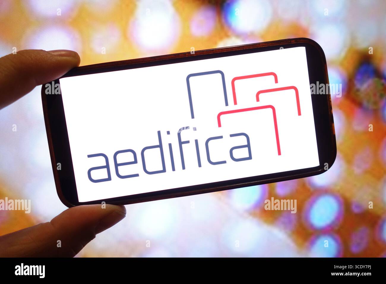 In this photo illustration, an Aedifica company logo is seen displayed ...