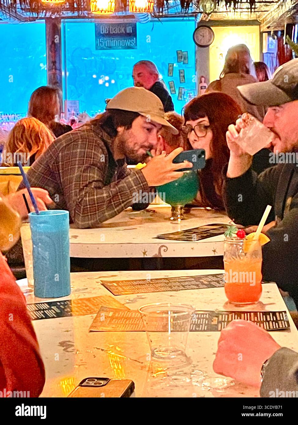 The Sip n' Dip Lounge is a Funky, old-school cocktail lounge with a tiki theme showcasing swimming mermaids behind the bar, Great Falls MT, 2025 - Smartphone Captured Stock Image