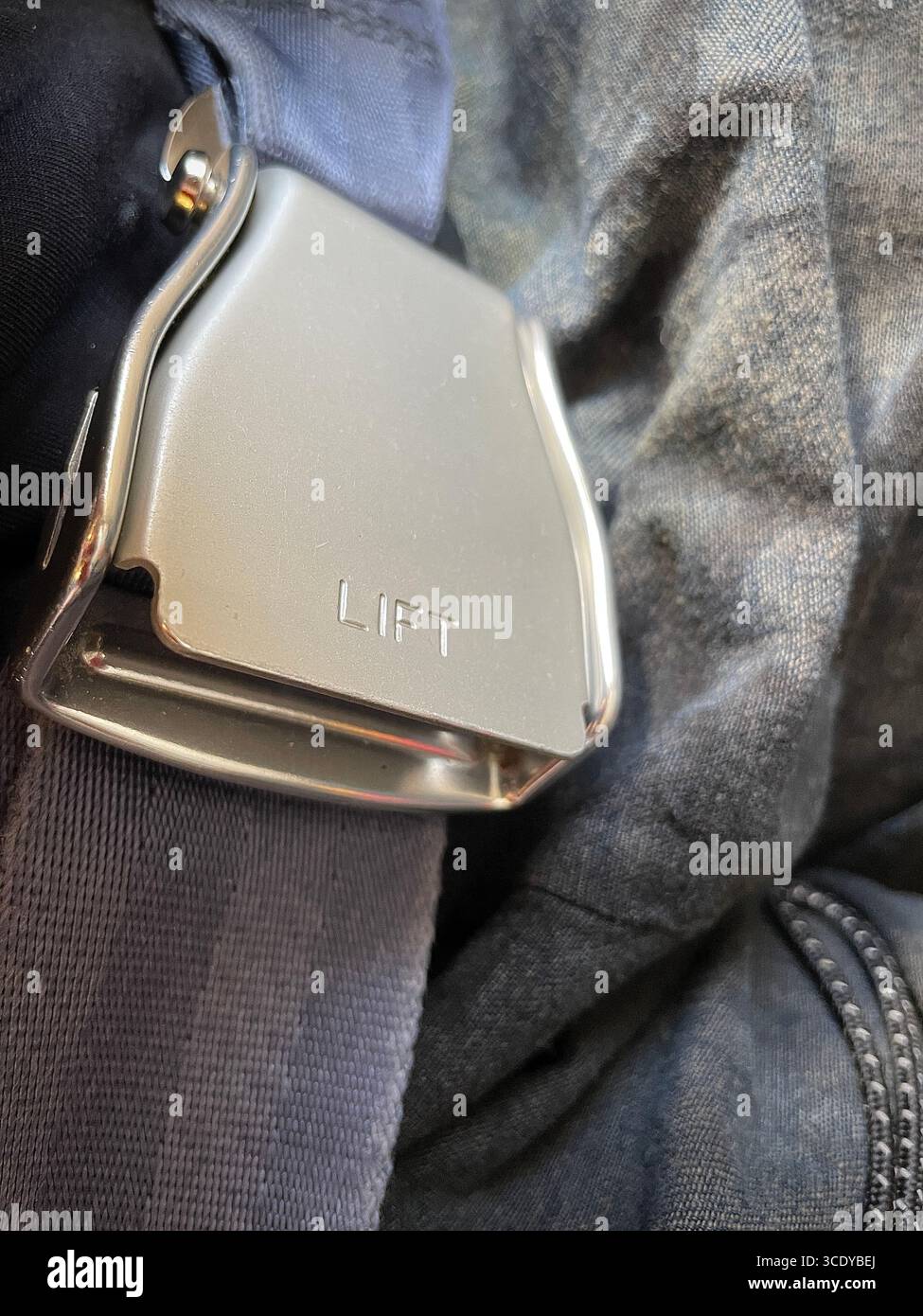 Close up of a seatbelt  in the cabin of a major airline, 2025, United States - Smartphone Captured Stock Image