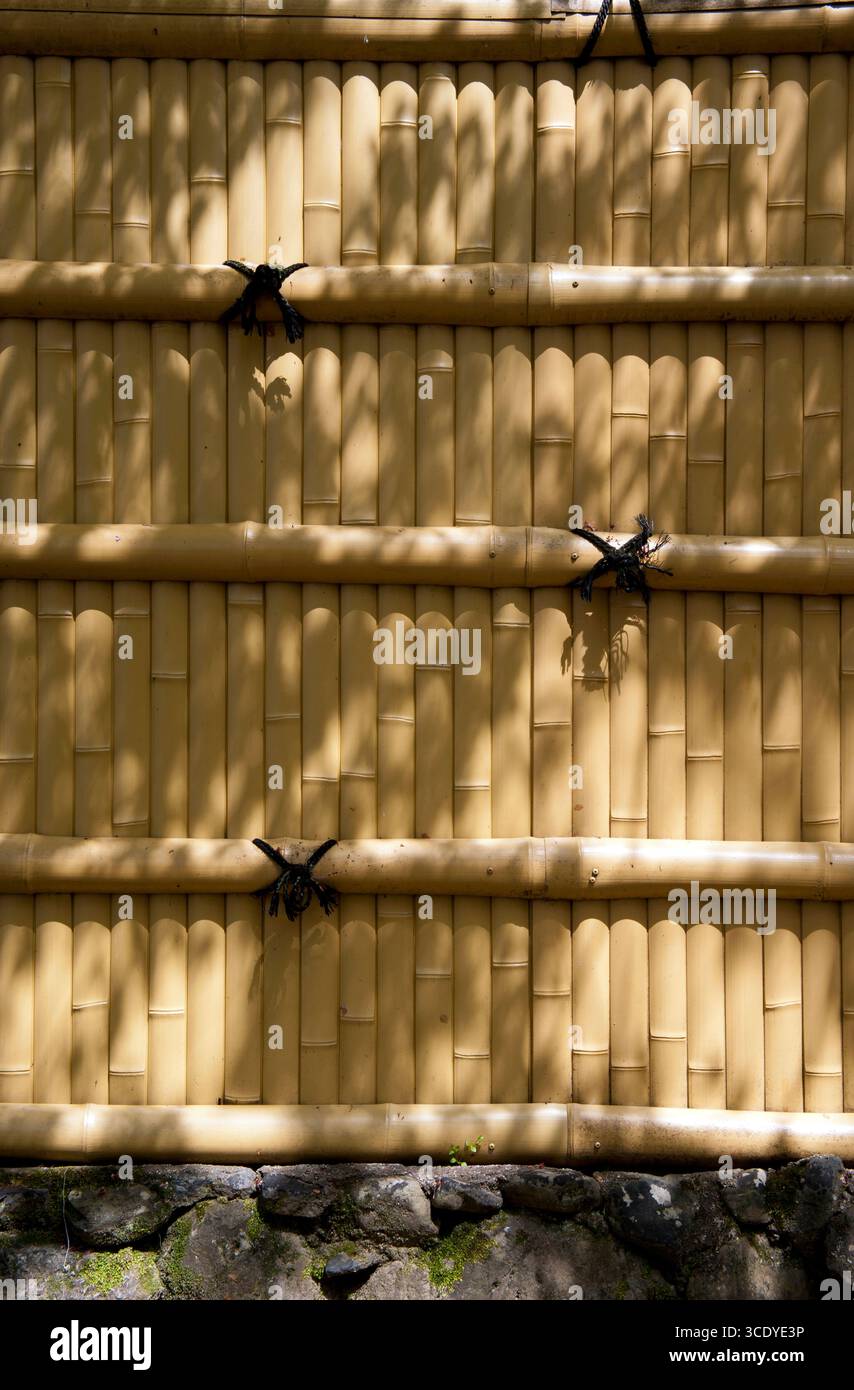 Slats With Rope Bamboo fence with vertical and horizontal slats tied together with ...