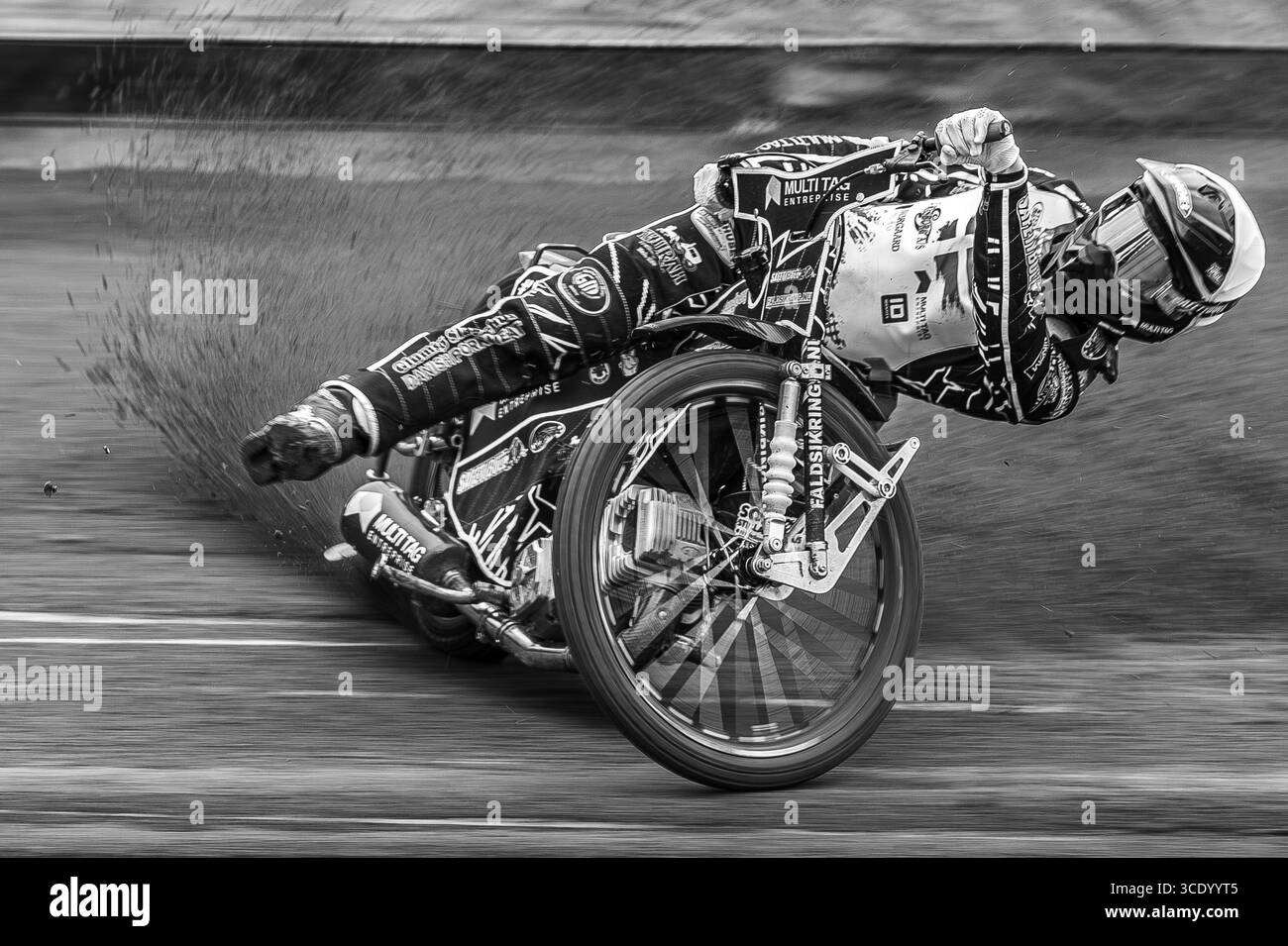 Dramatic Monochrome Action Image Of Danish Speedway Rider Villads Nagel's Spectacular Racing Style At Glasgow Tigers' Speedway, Scotland, UK. Stock Photo