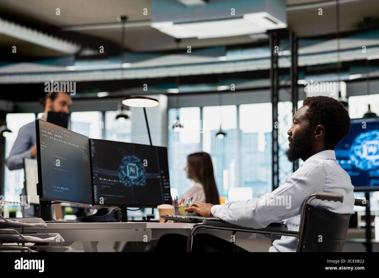 IT specialist in wheelchair developing software applications using AI automation. Programmer with paraplegia in inclusive office debugging applications with artificial intelligence Stock Photo