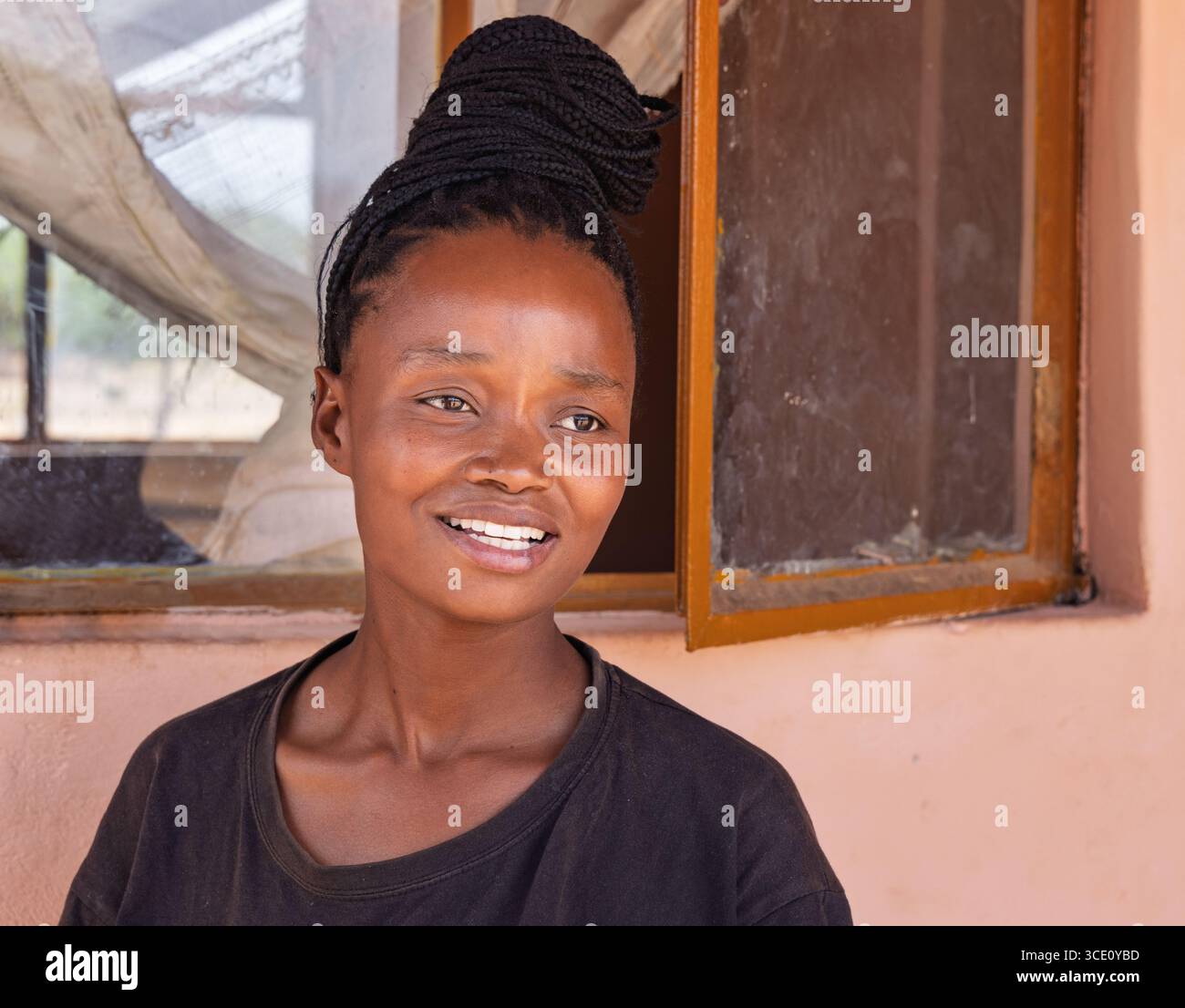 african village, portrait single young woman with braids hairstyle in ...