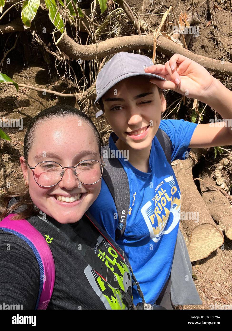 Two smiling participants take a selfie on the trail during the Trail Run Nordeste Real Priolo event in the Azores, Portugal. - Smartphone Captured Stock Image
