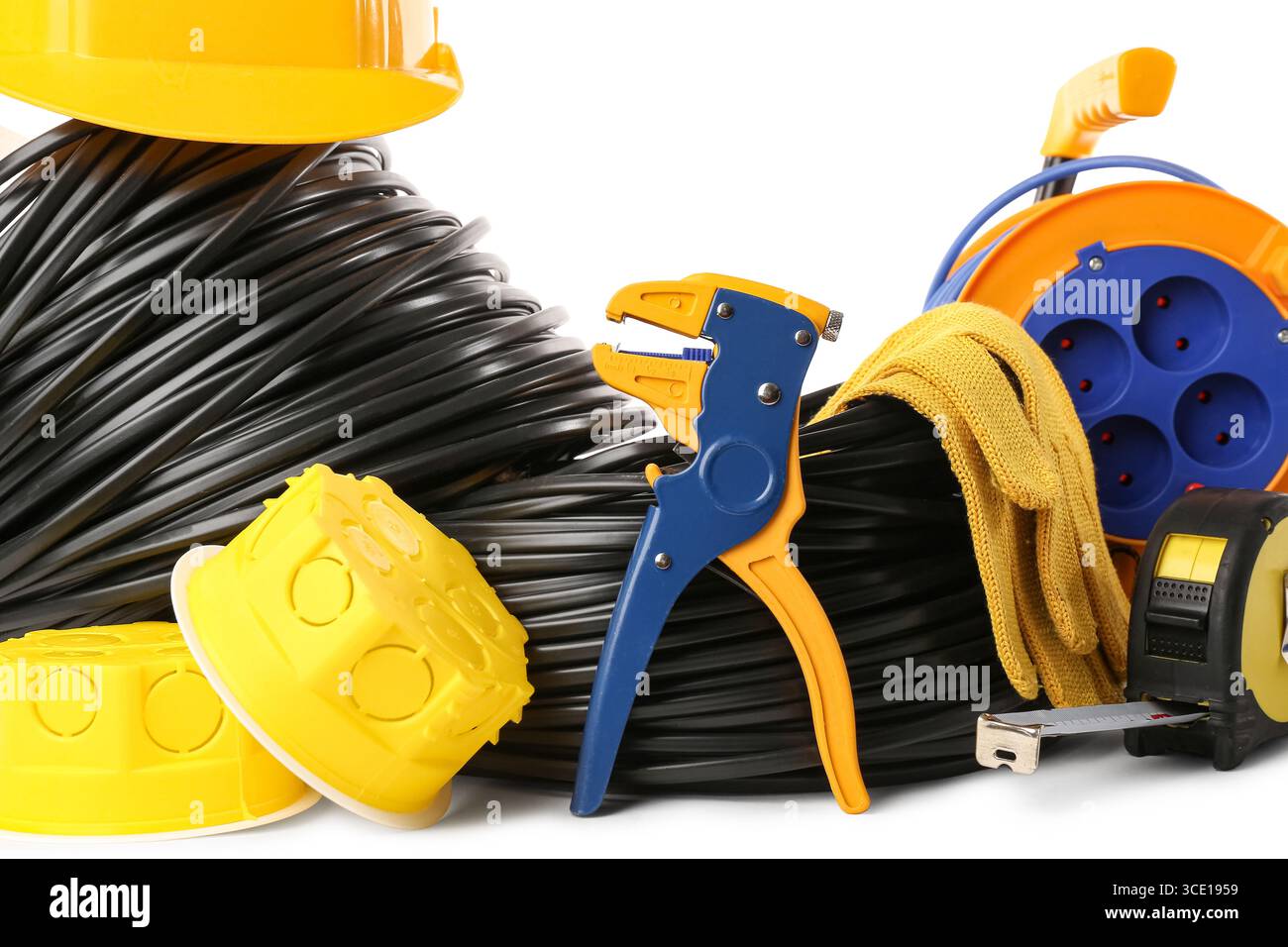 Rolled cables with electrician tools and electrical junction boxes on white background Stock Photo
