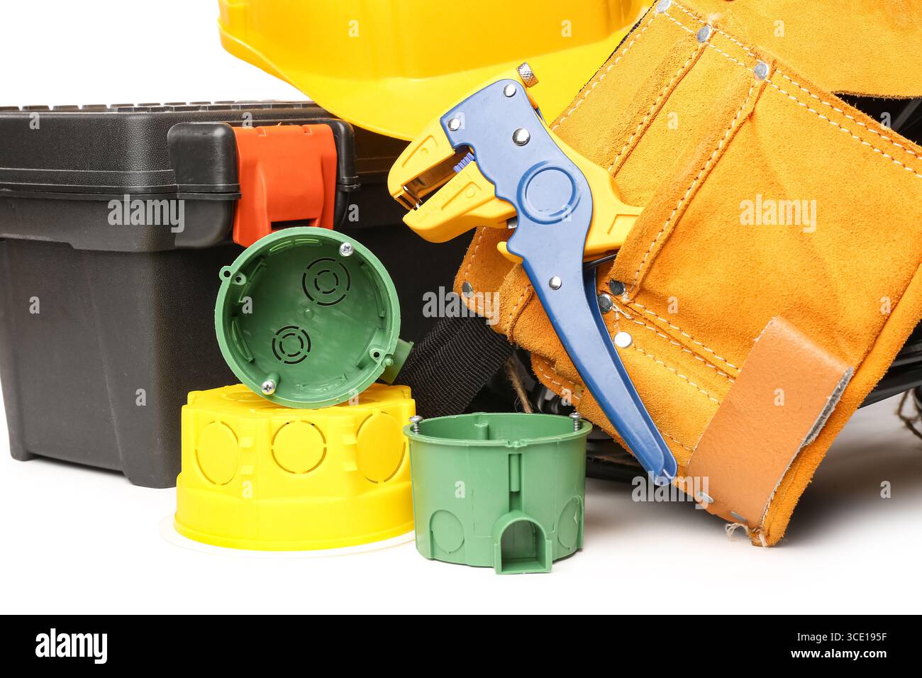 Electrician tools, rolled cables, electrical junction box and socket mounting boxes on white background Stock Photo