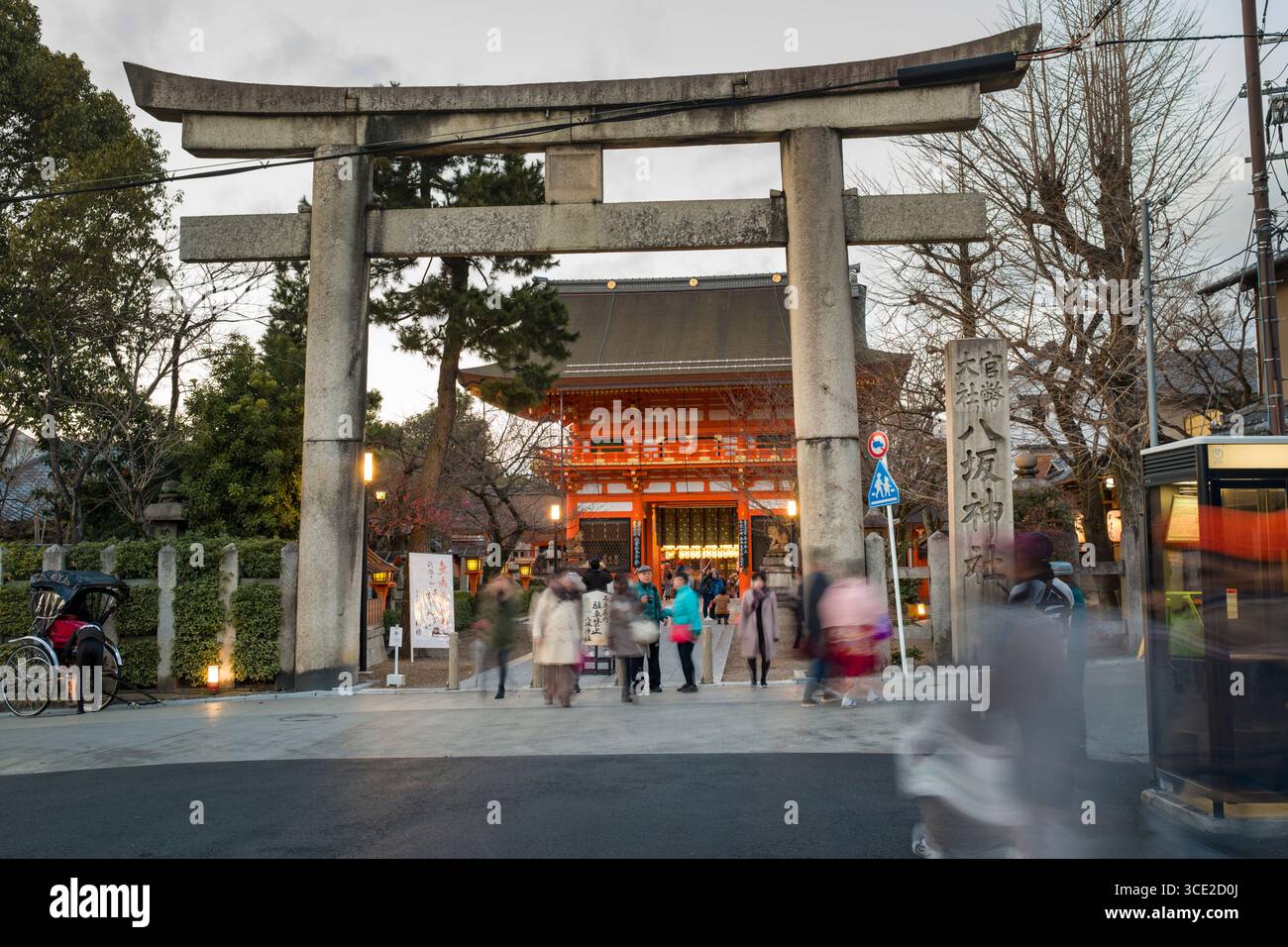Large stone torii gate at the entrance to the Yasaka-Jinja Shrine ...