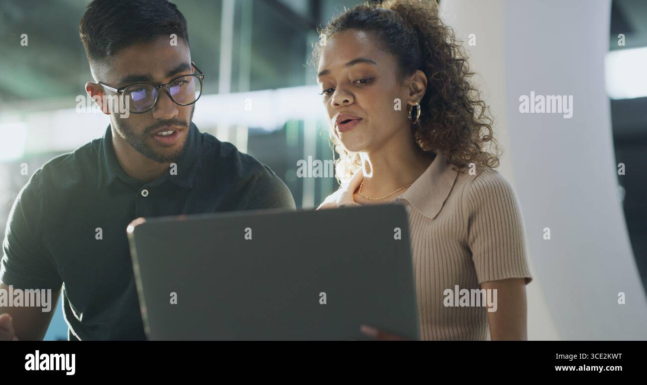 Laptop, discussion and web developers in office with troubleshooting online problem. Computer, team and IT professionals with conversation on Stock Photo