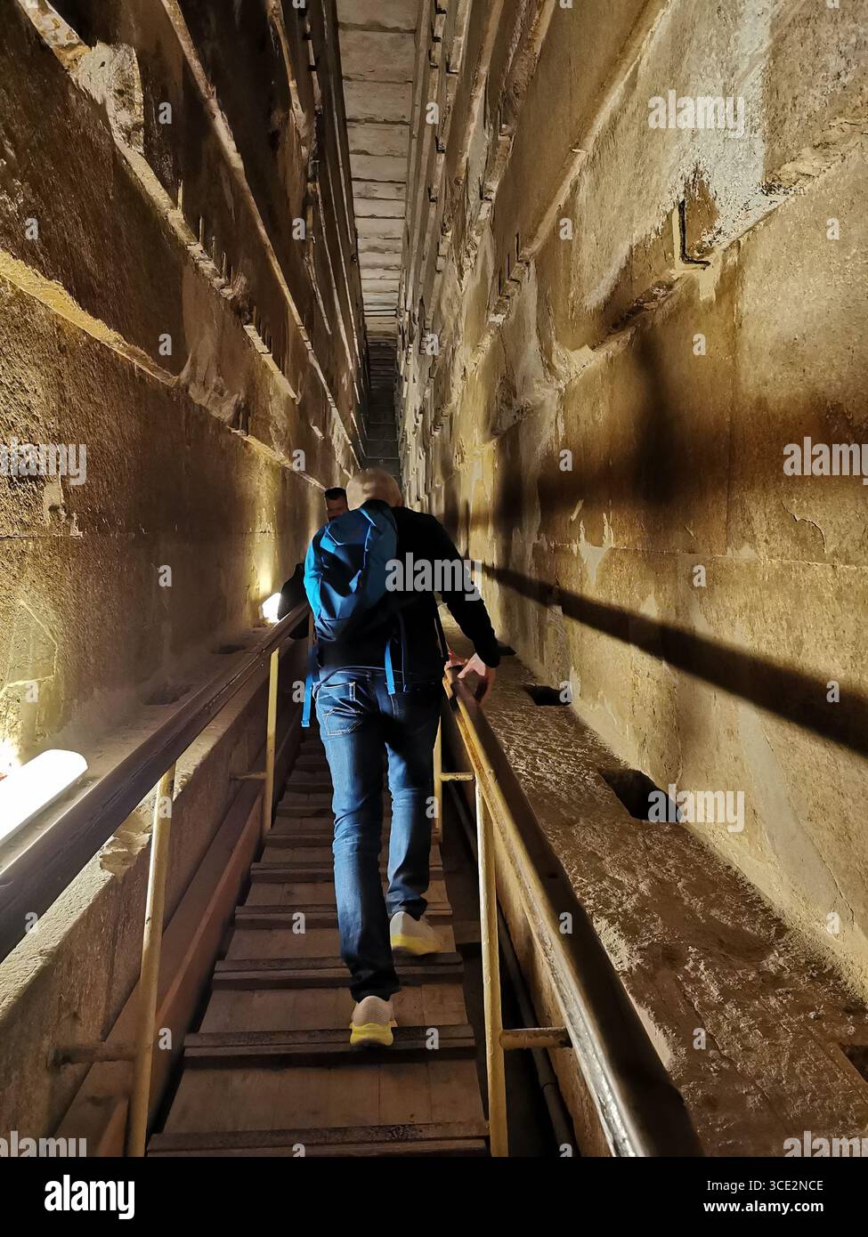 Interior of Great Pyramid of Giza, Egypt. View of narrow tunnel leading  toward the King's Chamber, part of the ancient burial site of Pharaoh Khufu. - Smartphone Captured Stock Image