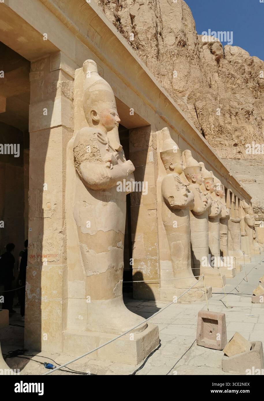 Temple of Hatshepsut, Luxor—freestanding mummy-style pillars in ancient Egyptian architecture, glowing in desert light. - Smartphone Captured Stock Image