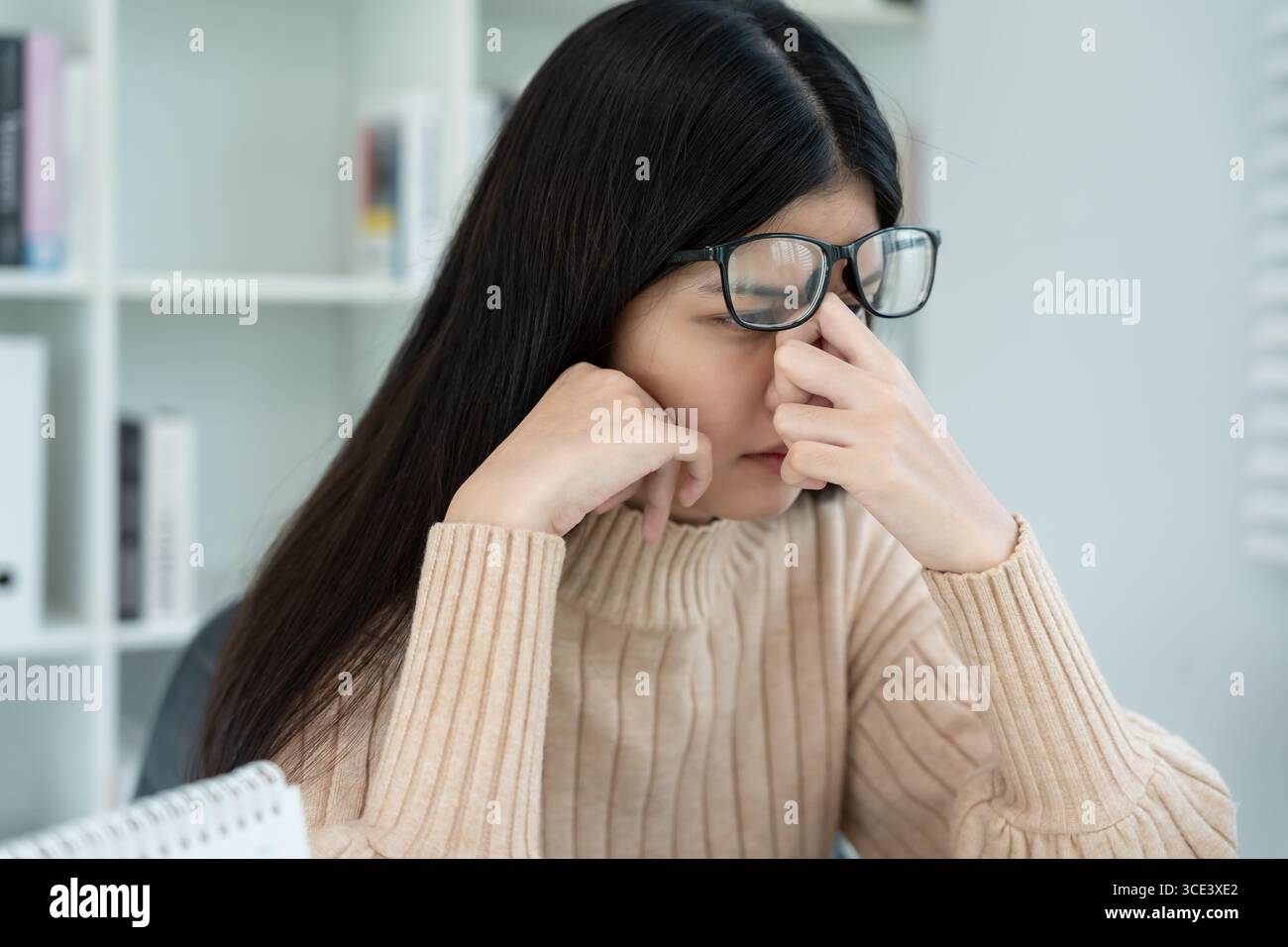 Eye problems, Asian women with tired and irritated eyes, eye rubbing ...
