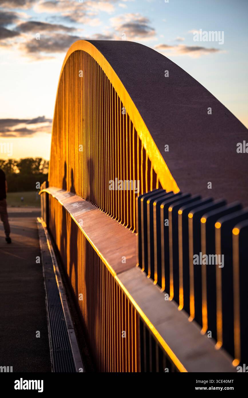 Bridge with people shadows at sunset, Queen Elizabeth Olympic Park in Stratford, London Borough of Newham, London, England, UK Stock Photo