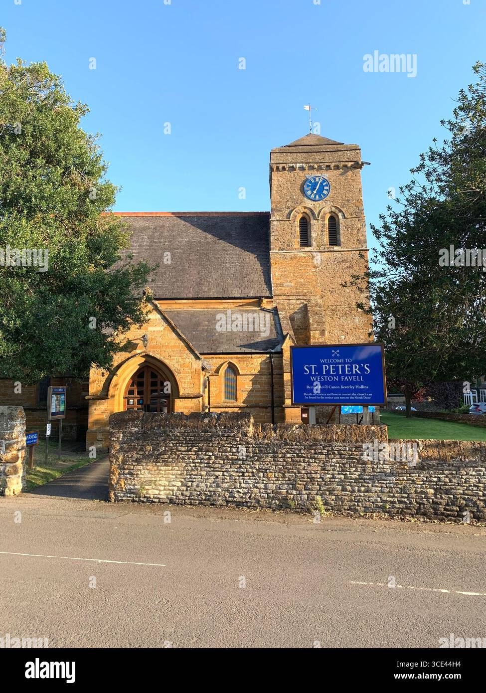 House Church Weston Favell Northampton Northamptonshire Uk British England old style stone building historic village style type graves grave blue sky - Smartphone Captured Stock Image