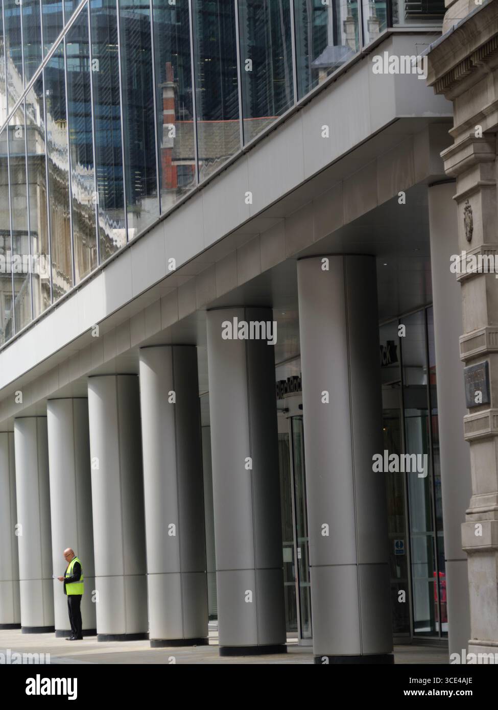 08/08/2025 — Security guard standing outside the BlackRock headquarters ...