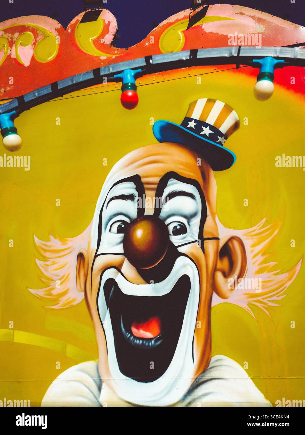 Colorful circus clowns painted on a vibrant backdrop celebrating fun and joy in an entertainment setting. France - Smartphone Captured Stock Image