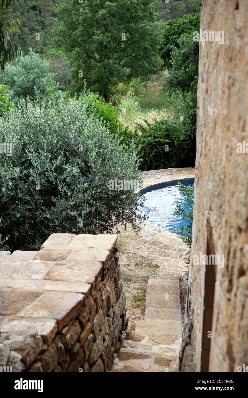 Stone stairs leading to the pool Stock Photo