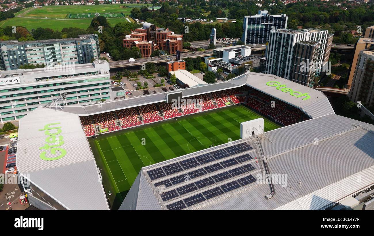 LONDON, UK - AUGUST 5, 2025 - Aerial view of Gtech Community Stadium, home of Brentford FC in London, showcasing solar panels, red seats, and surround Stock Photo