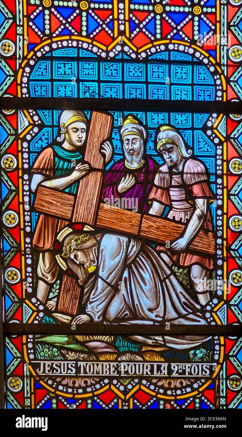 Rochefort, Belgium - July 23, 2025: Stained glass window depicting the ...