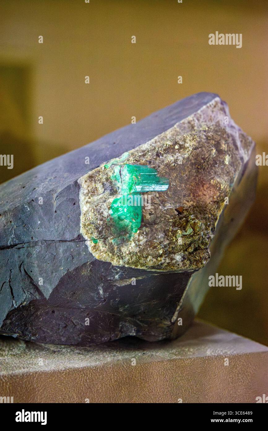 A stunning Colombian emerald embedded in a rock display at the Emerald ...