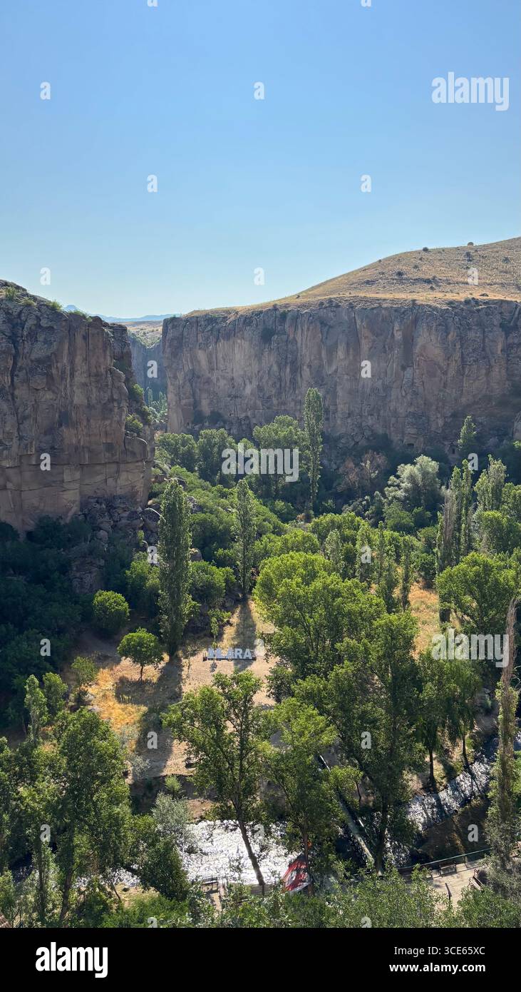 A panaromic view of the Ihlara Valley in Aksaray, Cappadocia, Central Anatolia, Turkey, showing dramatic rock cliffs, Melendiz River - Smartphone Captured Stock Image