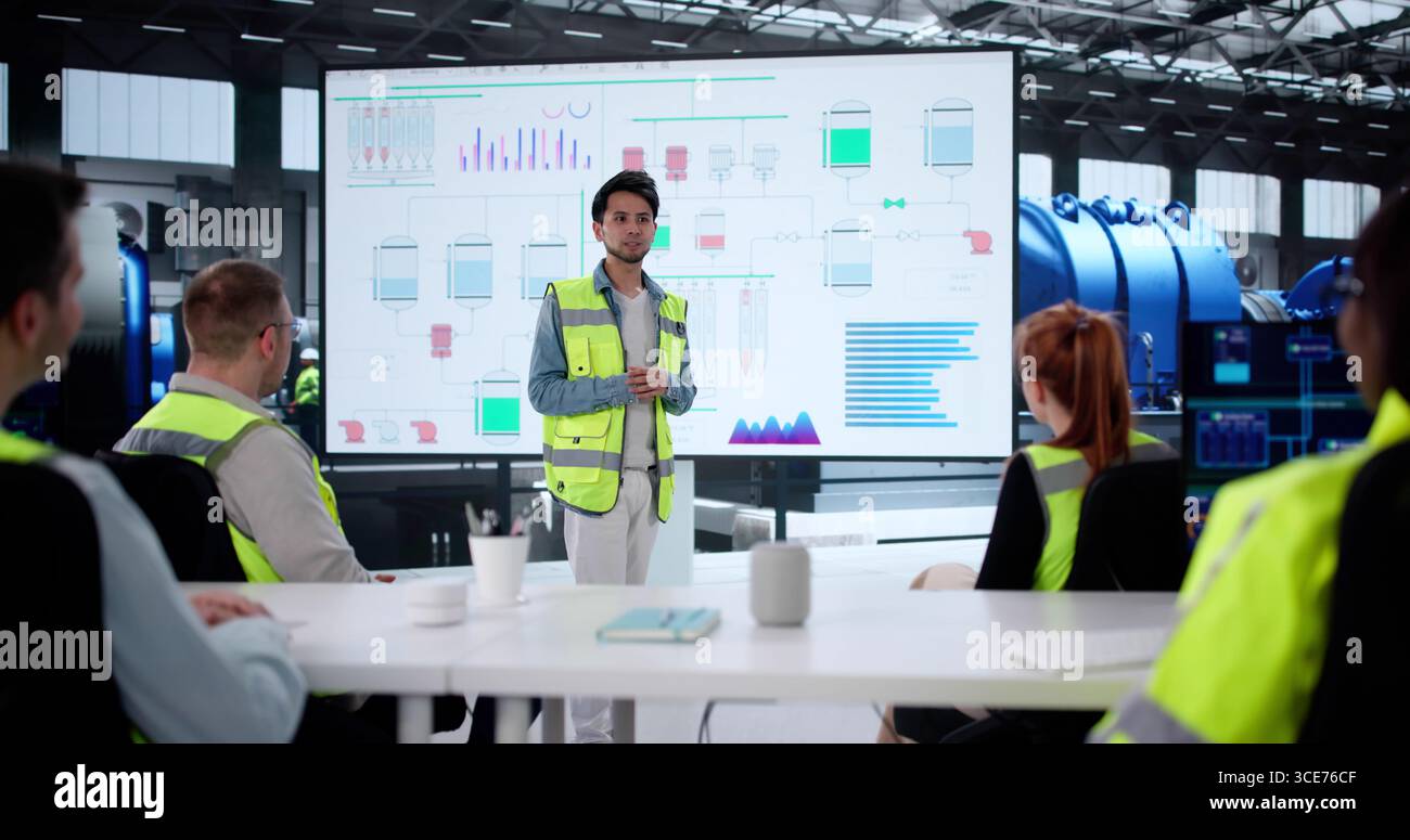 Diverse Group Of Professionals Giving Training Session On New AI System. Stock Photo