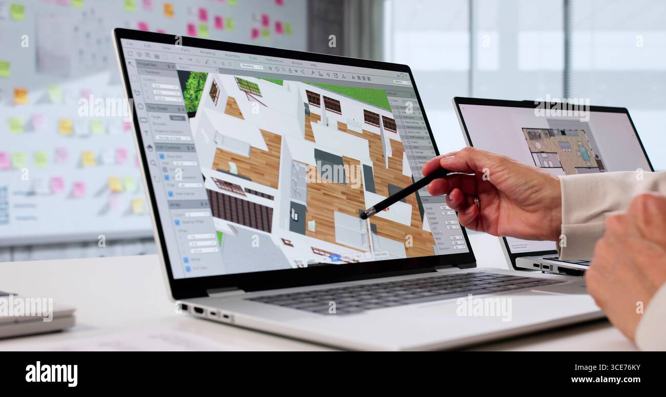 Senior Interior Designer Using 3D CAD Model For Property Remodel. Stock Photo