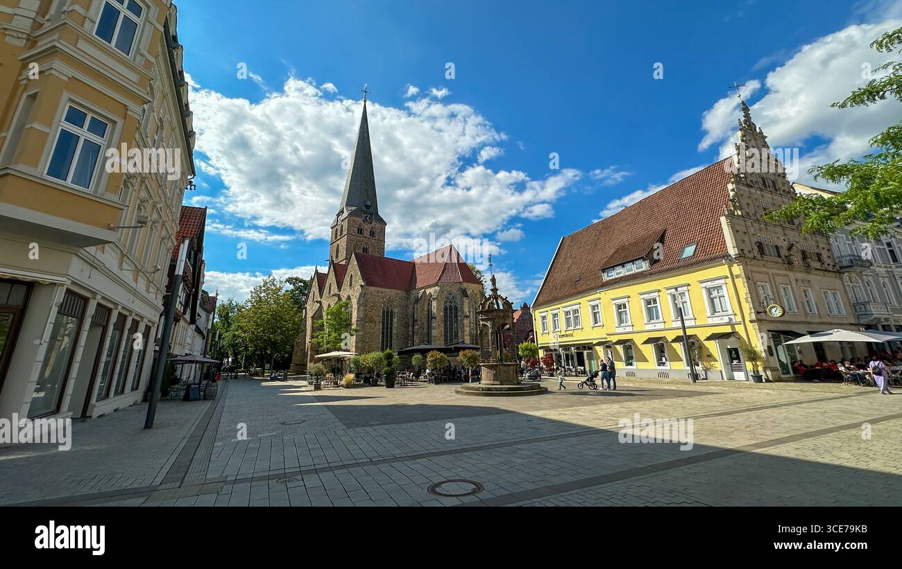 The historic Neuer Markt square in Herford, Germany, featuring St. Johannis Church, Renaissance town hall, and a reconstructed knight's fountain. Stock Photo