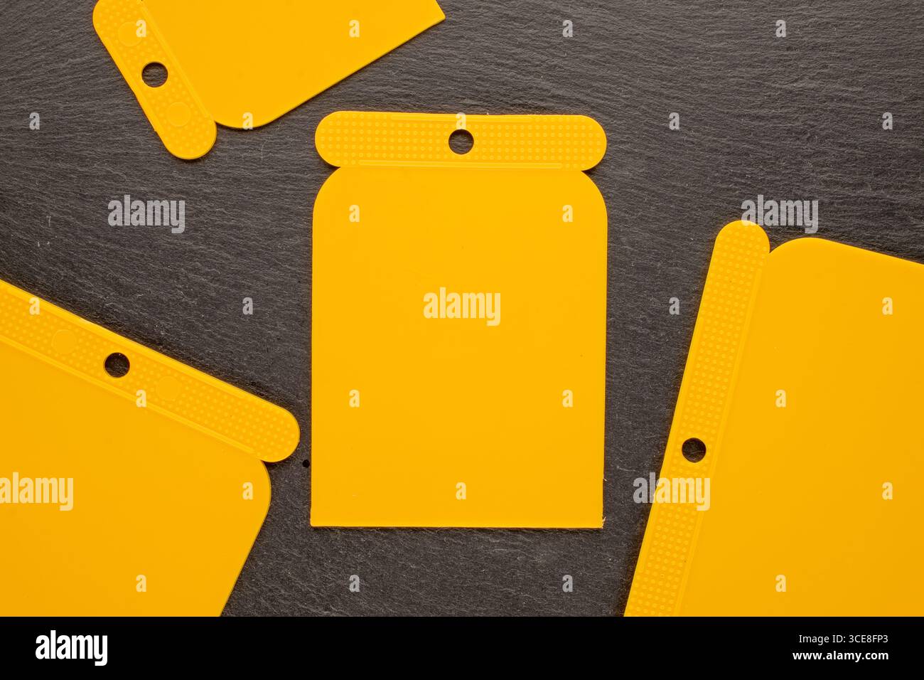 Set of plastic spatulas for applying putty, macro, top view Stock Photo ...