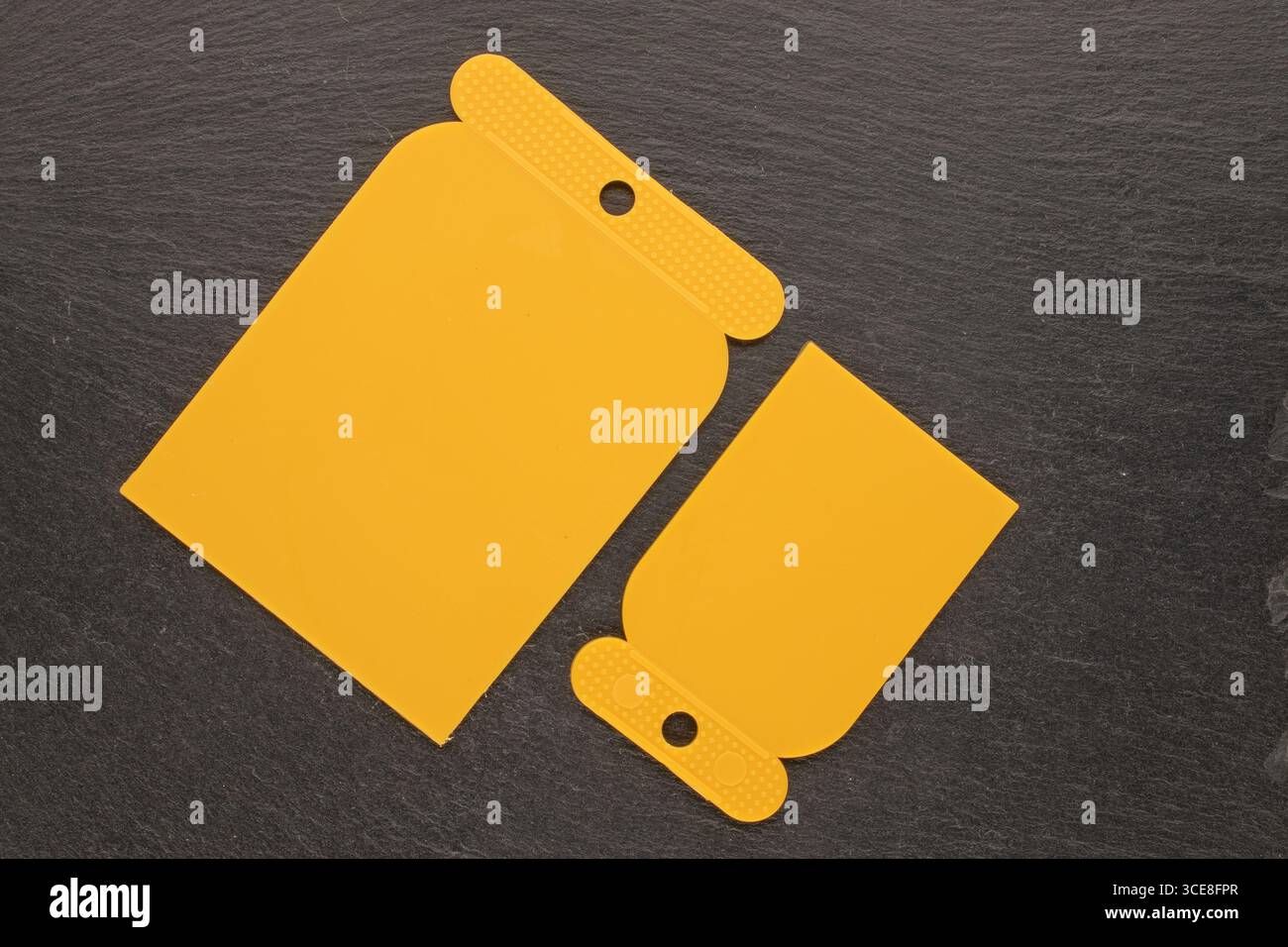 Set of plastic spatulas for applying putty, macro, top view Stock Photo ...