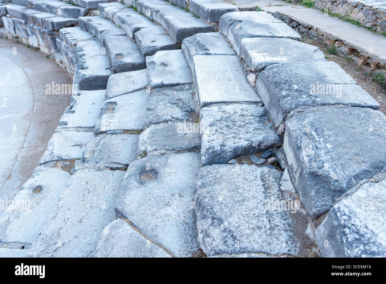 Close-up of the ancient stone seating of the theatre of Philippi, highlighting the craftsmanship and weathered texture Stock Photo